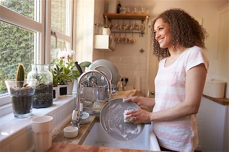 Woman Standing At Kitchen Sink Washing Up Stock Photo - Budget Royalty-Free & Subscription, Code: 400-08837848