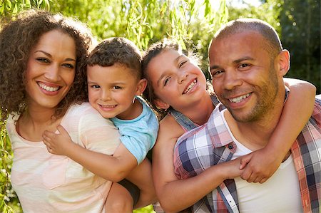 Outdoor Head And Shoulders Portrait Of Family In Garden Stock Photo - Budget Royalty-Free & Subscription, Code: 400-08837870