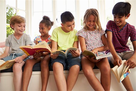 Group Of Multi-Cultural Children Reading On Window Seat Stock Photo - Budget Royalty-Free & Subscription, Code: 400-08837906