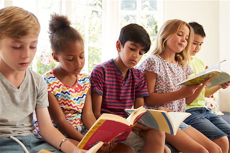 Group Of Multi-Cultural Children Reading On Window Seat Stock Photo - Budget Royalty-Free & Subscription, Code: 400-08837901