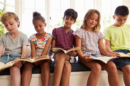 Group Of Multi-Cultural Children Reading On Window Seat Stock Photo - Budget Royalty-Free & Subscription, Code: 400-08837902