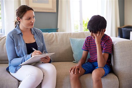 Young Boy With Problems Talking With Counselor At Home Stock Photo - Budget Royalty-Free & Subscription, Code: 400-08837925