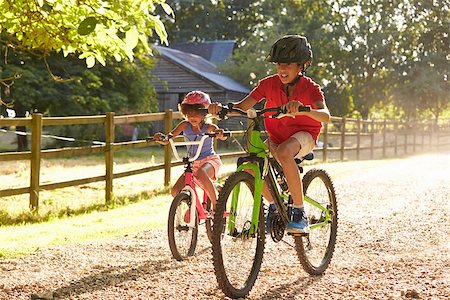 Two Children On Cycle Ride Together Stock Photo - Budget Royalty-Free & Subscription, Code: 400-08837940