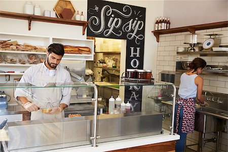 simsearch:400-08838017,k - Two people working behind the counter at a sandwich bar Photographie de stock - Aubaine LD & Abonnement, Code: 400-08837965