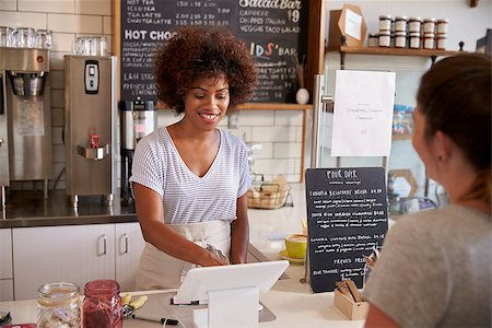 Waitress taking a customerÕs order at till in a coffee shop Stock Photo - Budget Royalty-Free & Subscription, Code: 400-08837997