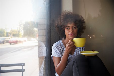 deli window - Young black woman sitting beside a window in a cafe Stock Photo - Budget Royalty-Free & Subscription, Code: 400-08838068