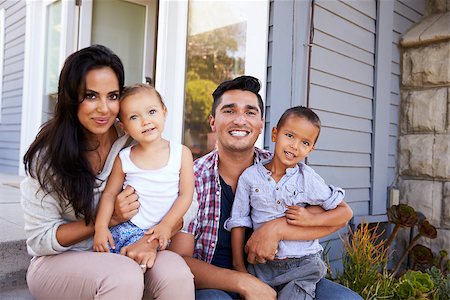 simsearch:400-05736759,k - Portrait Of Family Sitting On Steps Outside Home Stock Photo - Budget Royalty-Free & Subscription, Code: 400-08838104