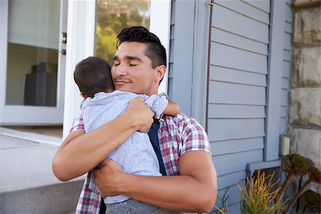 simsearch:400-05736759,k - Father Hugging Son Sitting On Steps Outside Home Stock Photo - Budget Royalty-Free & Subscription, Code: 400-08838107