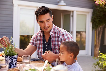 saying grace at male dinner - Father And Son Saying Grace Before Outdoor Meal In Garden Photographie de stock - Aubaine LD & Abonnement, Code: 400-08838131