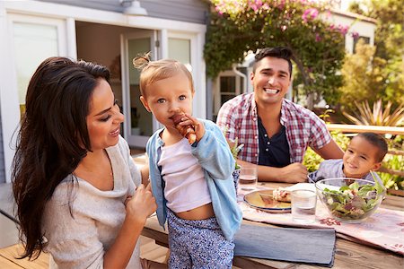 pictures of baby eating dinner with family - Portrait Of Family At Home Eating Outdoor Meal In Garden Stock Photo - Budget Royalty-Free & Subscription, Code: 400-08838133