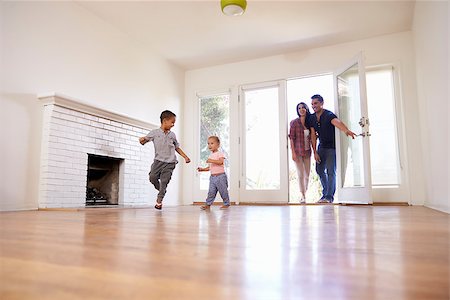 simsearch:400-09122233,k - Excited Family Explore New Home On Moving Day Stock Photo - Budget Royalty-Free & Subscription, Code: 400-08838144