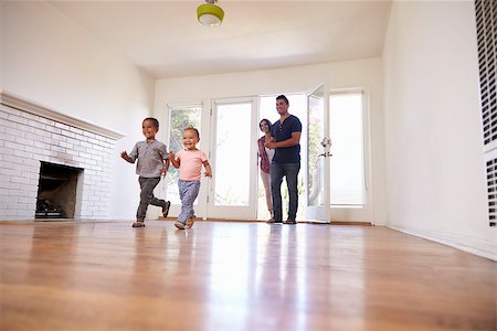 simsearch:400-09122233,k - Excited Family Explore New Home On Moving Day Stock Photo - Budget Royalty-Free & Subscription, Code: 400-08838145