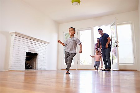 simsearch:400-09122233,k - Excited Family Explore New Home On Moving Day Stock Photo - Budget Royalty-Free & Subscription, Code: 400-08838143