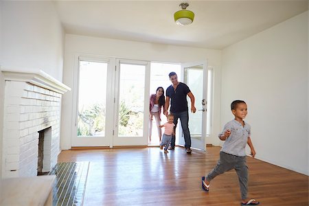 simsearch:400-09122233,k - Excited Family Explore New Home On Moving Day Stock Photo - Budget Royalty-Free & Subscription, Code: 400-08838150