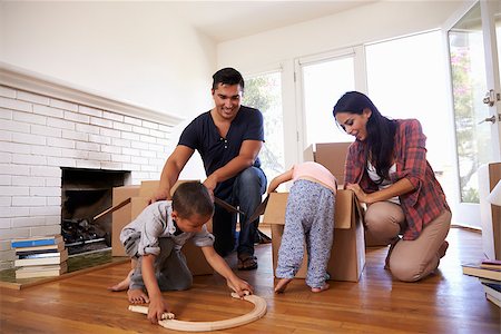simsearch:400-09122233,k - Family Unpacking Boxes In New Home On Moving Day Stock Photo - Budget Royalty-Free & Subscription, Code: 400-08838160