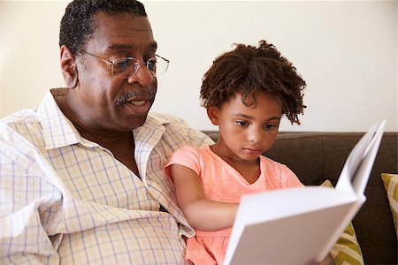 Grandfather And Granddaughter Reading Book At Home Together Stock Photo - Budget Royalty-Free & Subscription, Code: 400-08838246