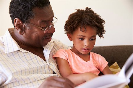 Grandfather And Granddaughter Reading Book At Home Together Stock Photo - Budget Royalty-Free & Subscription, Code: 400-08838247
