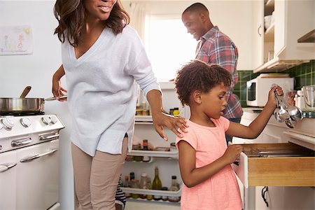 Family At Home Preparing Meal In Kitchen Together Stock Photo - Budget Royalty-Free & Subscription, Code: 400-08838240