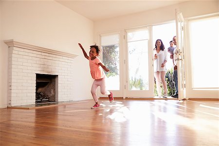 simsearch:400-09122233,k - Excited Family Explore New Home On Moving Day Stock Photo - Budget Royalty-Free & Subscription, Code: 400-08838286