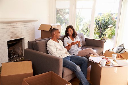 simsearch:400-08938320,k - Couple Take A Break On Sofa With Pizza On Moving Day Stock Photo - Budget Royalty-Free & Subscription, Code: 400-08838281