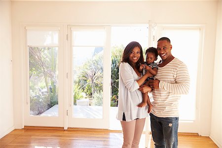 simsearch:400-08938320,k - Portrait Of Family In New Home On Moving Day Stock Photo - Budget Royalty-Free & Subscription, Code: 400-08838290