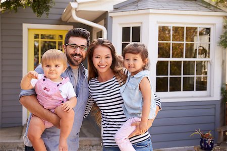 simsearch:400-09122233,k - Portrait Of Excited Family Standing Outside New Home Stock Photo - Budget Royalty-Free & Subscription, Code: 400-08838347