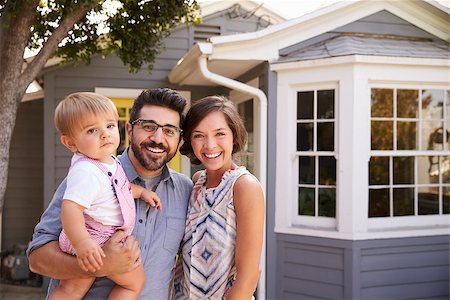 simsearch:400-08938320,k - Portrait Of Excited Family Standing Outside New Home Stock Photo - Budget Royalty-Free & Subscription, Code: 400-08838350