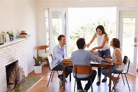 dinner party friends indoors young adults - Group Of Friends Enjoying Dinner Party At Home Together Stock Photo - Budget Royalty-Free & Subscription, Code: 400-08838383