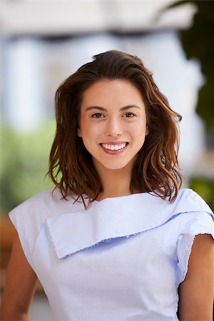 filipina businesswoman - Portrait of smiling young mixed race businesswoman, vertical Stock Photo - Budget Royalty-Free & Subscription, Code: 400-08838771