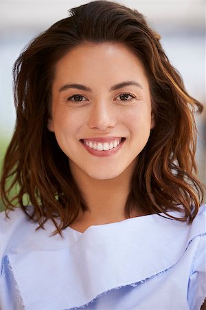 simsearch:400-08838779,k - Smiling mixed race young businesswoman, vertical, close up Stock Photo - Budget Royalty-Free & Subscription, Code: 400-08838773