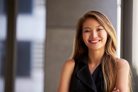 simsearch:400-08838779,k - Young Asian businesswoman smiling to camera, close up Stock Photo - Budget Royalty-Free & Subscription, Code: 400-08838820