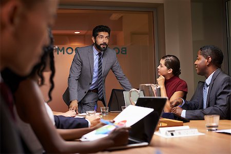 simsearch:400-08838985,k - Businessman addressing team at a boardroom meeting, close up Stock Photo - Budget Royalty-Free & Subscription, Code: 400-08838848