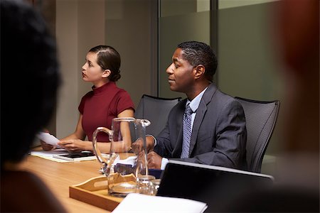simsearch:400-08838985,k - Business colleagues listening at boardroom meeting, close up Stock Photo - Budget Royalty-Free & Subscription, Code: 400-08838849