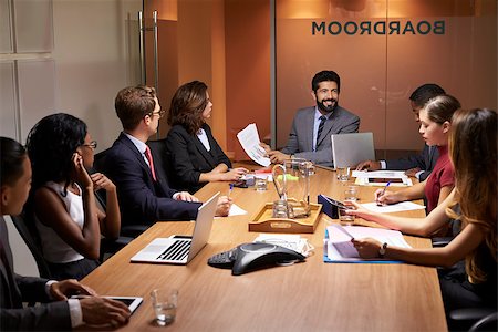simsearch:400-08838985,k - Corporate business people at an evening boardroom meeting Stock Photo - Budget Royalty-Free & Subscription, Code: 400-08838840