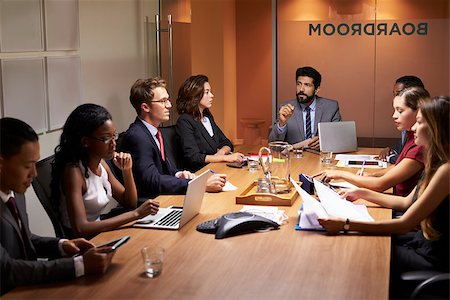 simsearch:400-08838985,k - Corporate business people at an evening boardroom meeting Stock Photo - Budget Royalty-Free & Subscription, Code: 400-08838841