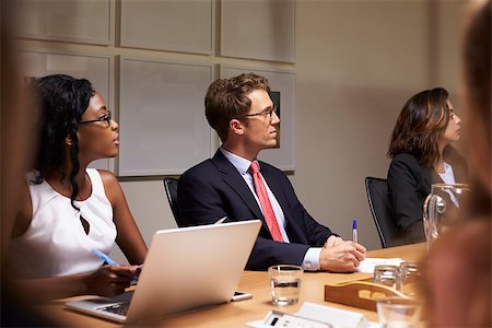 simsearch:400-08838985,k - Business colleagues listening at boardroom meeting Stock Photo - Budget Royalty-Free & Subscription, Code: 400-08838854