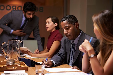 simsearch:400-08838924,k - Business colleagues working together at a boardroom meeting Stock Photo - Budget Royalty-Free & Subscription, Code: 400-08838857