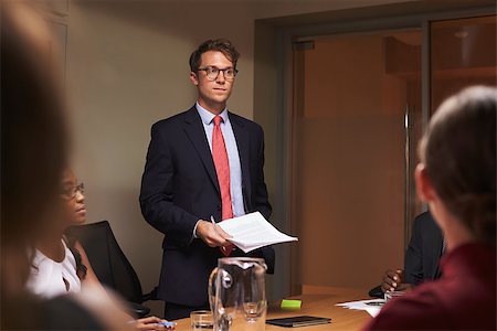 simsearch:400-08838924,k - Young white businessman addresses team at meeting, low angle Stock Photo - Budget Royalty-Free & Subscription, Code: 400-08838869