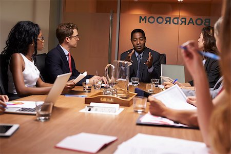 simsearch:400-08838985,k - Businessman addressing colleagues at a meeting, close up Stock Photo - Budget Royalty-Free & Subscription, Code: 400-08838861