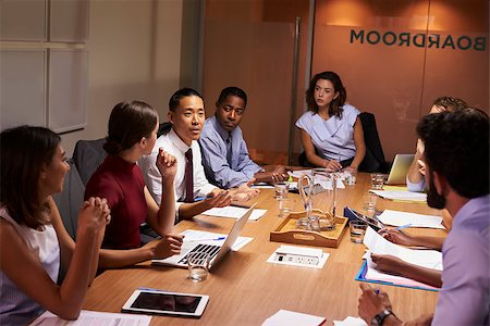 simsearch:400-08838924,k - Business colleagues in discussion at a meeting in boardroom Stock Photo - Budget Royalty-Free & Subscription, Code: 400-08838884