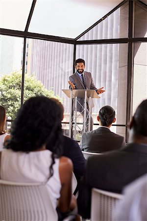 simsearch:400-08838945,k - Hispanic man presents business seminar to audience, vertical Foto de stock - Royalty-Free Super Valor e Assinatura, Número: 400-08838900