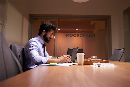 simsearch:400-08838924,k - Middle aged Hispanic businessman working late in an office Stock Photo - Budget Royalty-Free & Subscription, Code: 400-08838914