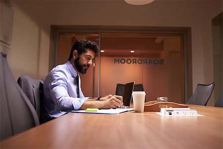 simsearch:400-08111295,k - Middle aged Hispanic businessman working late in an office Stock Photo - Budget Royalty-Free & Subscription, Code: 400-08838913
