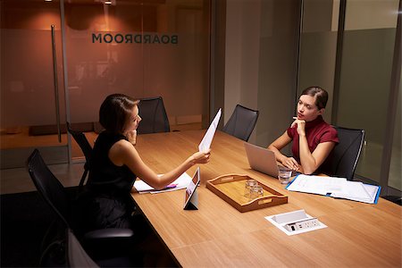 simsearch:400-04562604,k - Two businesswomen working late in office look at documents Photographie de stock - Aubaine LD & Abonnement, Code: 400-08838928