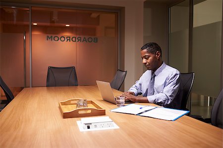 simsearch:614-00651999,k - Middle aged black businessman working late alone in office Stock Photo - Budget Royalty-Free & Subscription, Code: 400-08838921