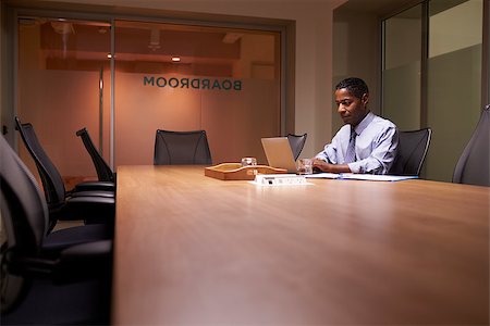 simsearch:400-08111295,k - Middle aged black businessman working late alone in office Stock Photo - Budget Royalty-Free & Subscription, Code: 400-08838922