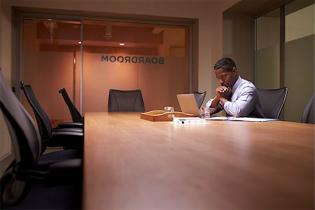 simsearch:614-00651999,k - Middle aged black businessman works on laptop late in office Stock Photo - Budget Royalty-Free & Subscription, Code: 400-08838923