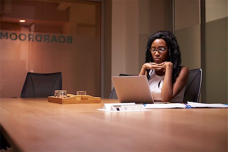 simsearch:400-08838924,k - Young black businesswoman working late alone in office Stock Photo - Budget Royalty-Free & Subscription, Code: 400-08838940
