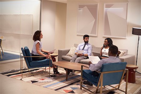 Four people meeting in lounge area of a corporate business Stockbilder - Microstock & Abonnement, Bildnummer: 400-08838992