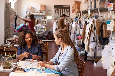 female native american clothing - Woman training apprentice at a clothes manufacturing studio Foto de stock - Super Valor sin royalties y Suscripción, Código: 400-08839024